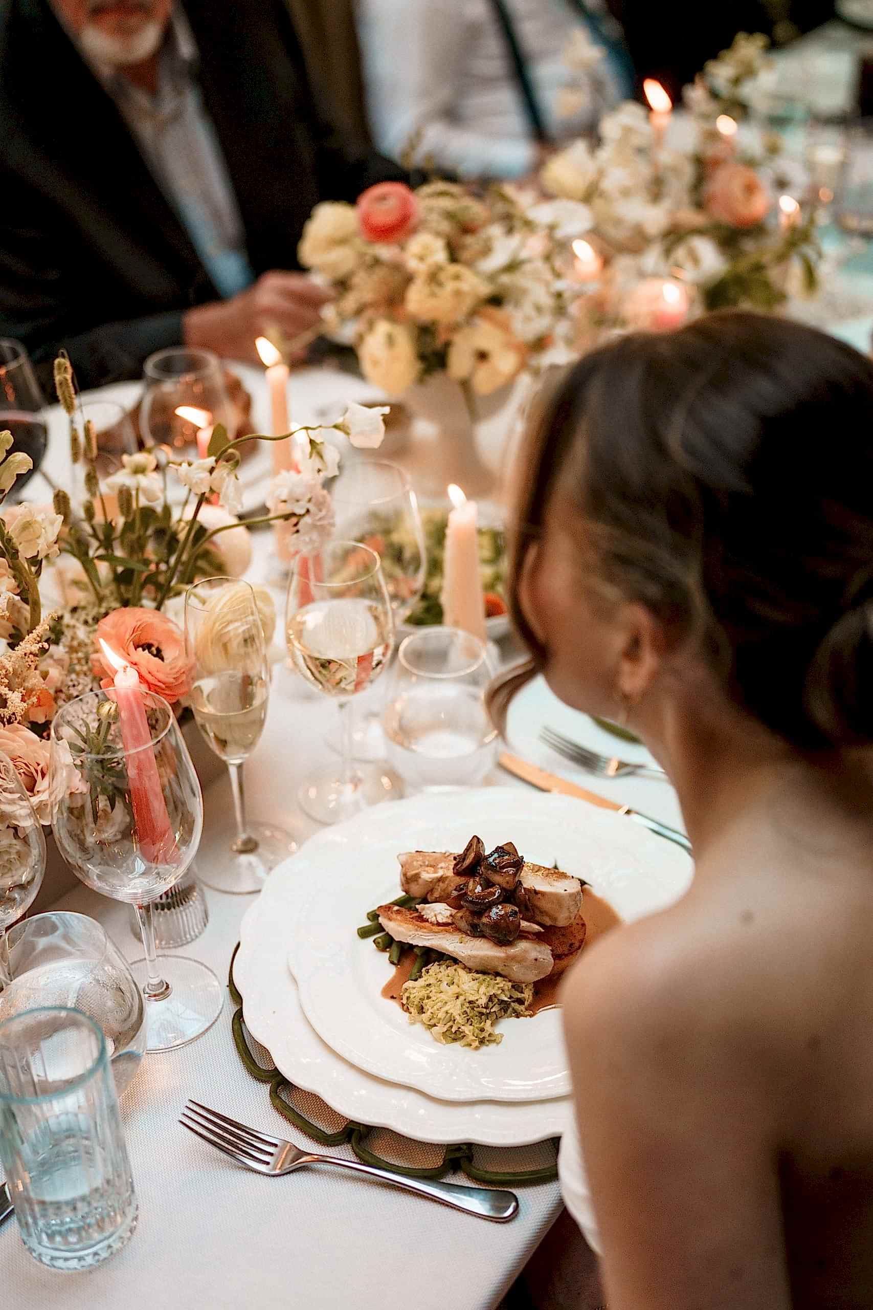 The image shows a bride at her wedding breakfast in the Orangery of Yorebridge House Hotel for a wedding in North Yorkshire.