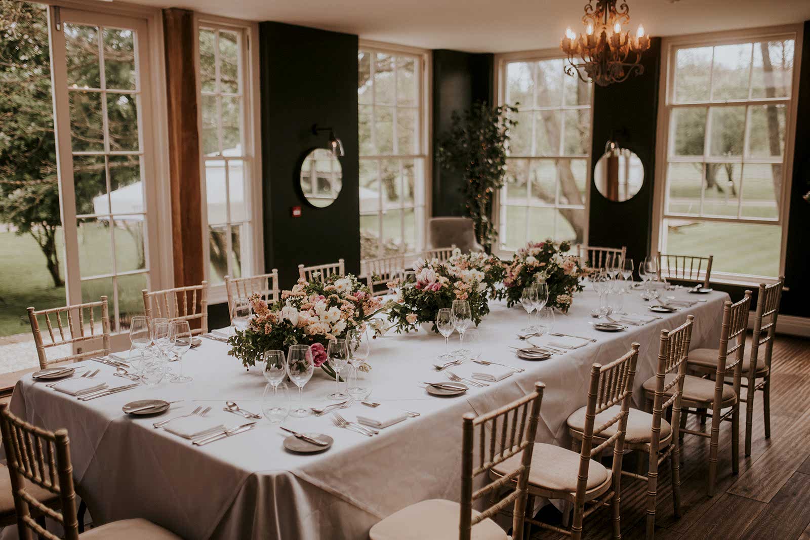 The image shows a wedding breakfast in the Orangery at Yorebridge House for an intimate wedding in North Yorkshire.
